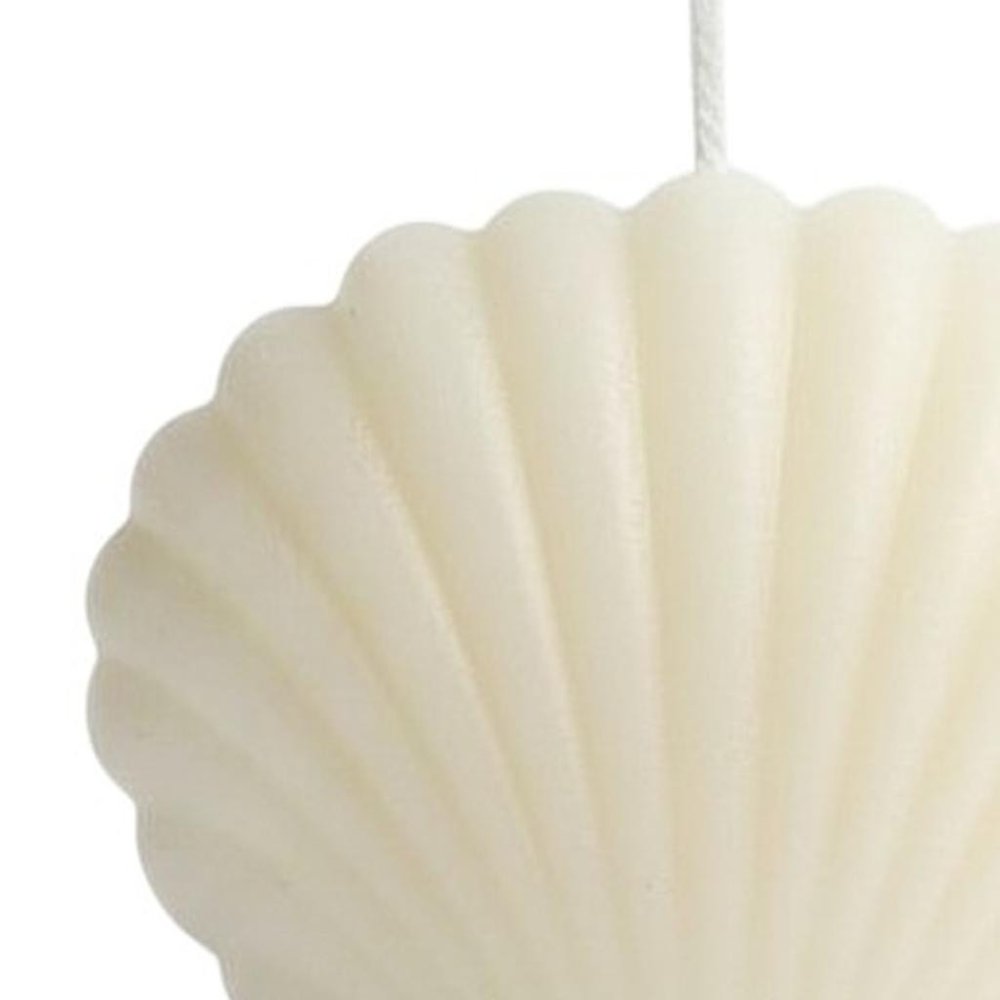 3" Ivory Clean Cotton Scented Dimensional Seashell Candle. Candle isolated on a plain white background, in a ivory cotton finish.