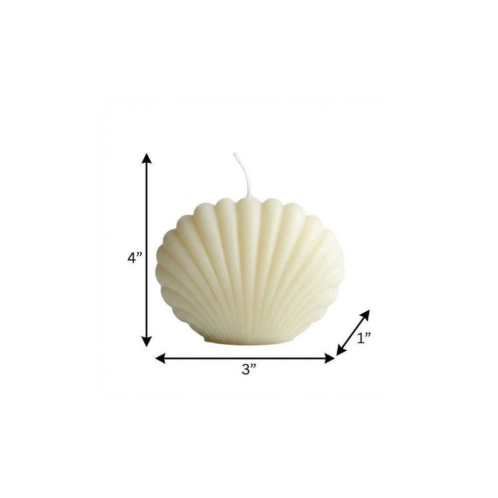 4" Ivory Black Ice Scented Dimensional Seashell Candle. Candle isolated on a plain white background, finished in ivory.