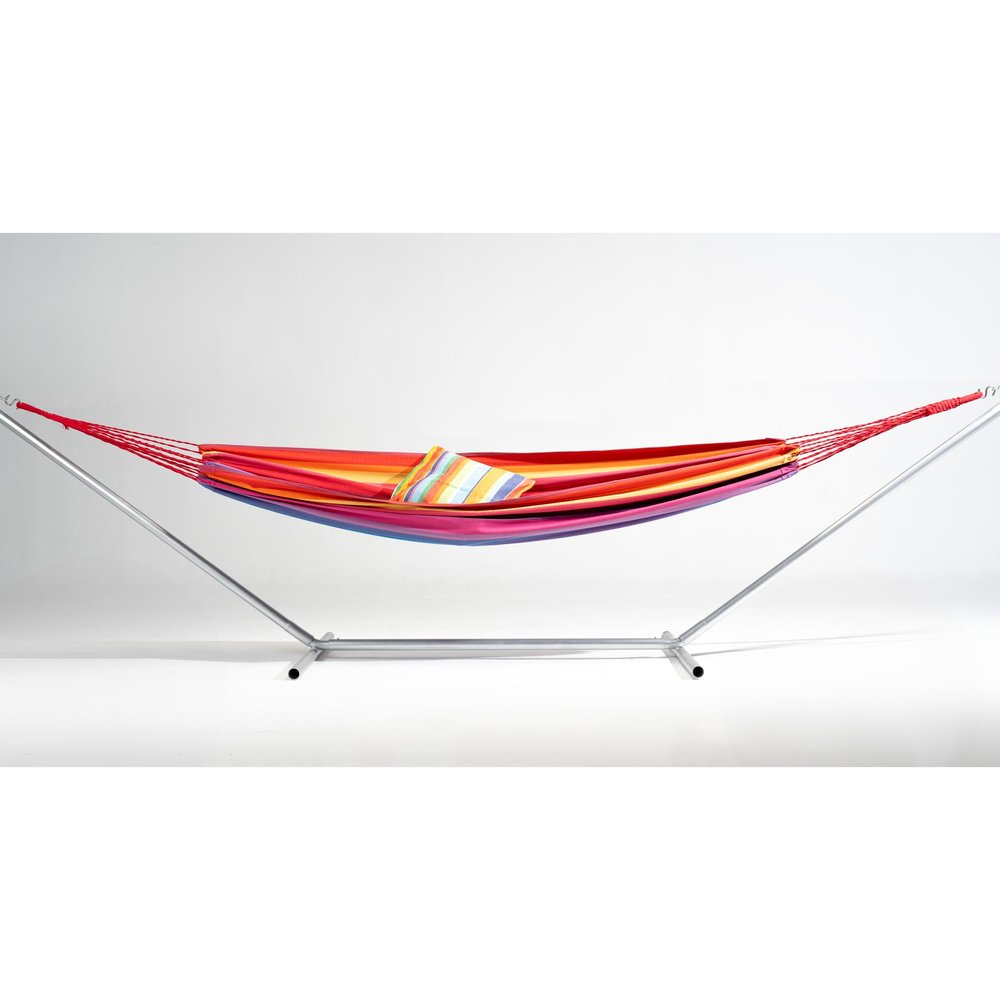 Striped hammock with pink, lavender, red, and yellow stripes on a silver metal stand against a white background.