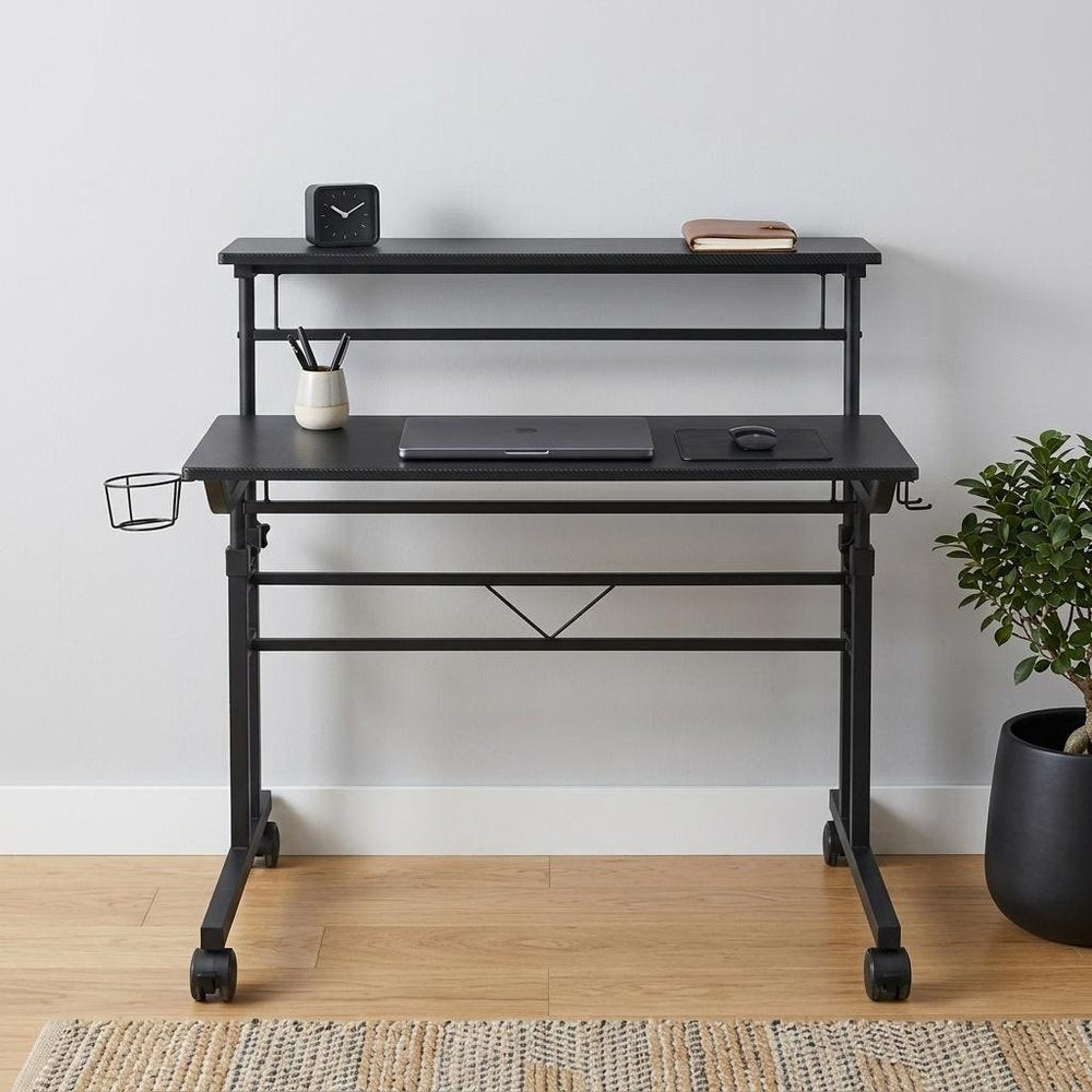 Adjustable Black Wood and Stainless Steel Rolling Writing Desk in a home interior