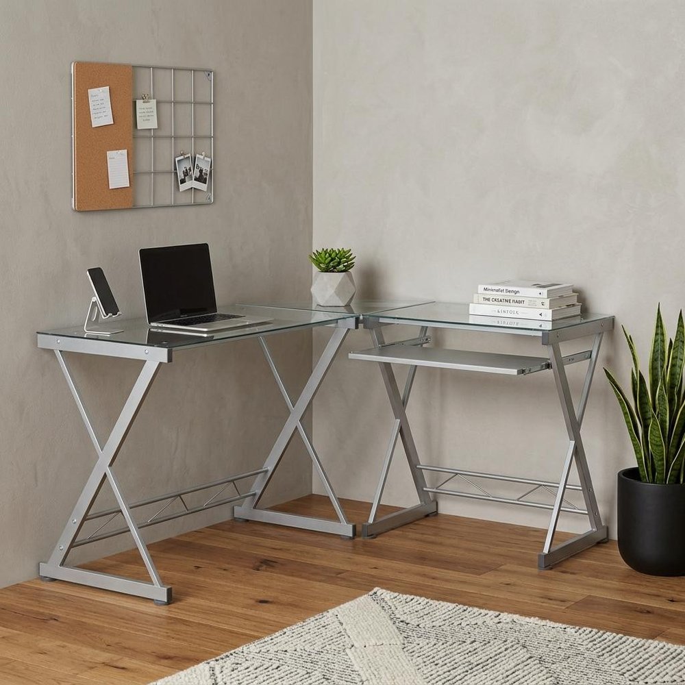 62" Clear Glass and Steel L Shape Computer Desk in a home interior
