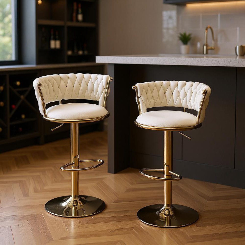 Set of Two Beige And Gold Velvet And Metal Low Back Adjustable Height Swivel Bar Chairs in a home interior