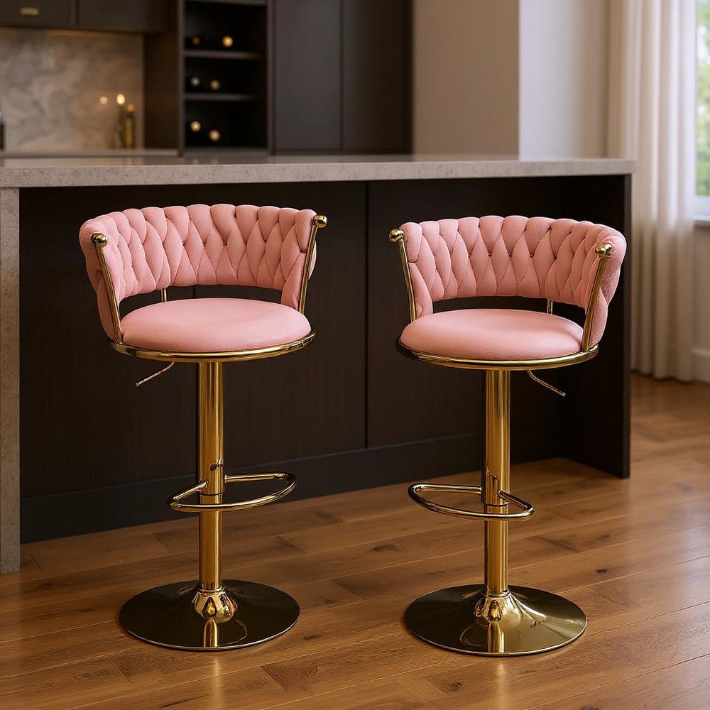 Set of Two Pink And Gold Velvet And Metal Low Back Adjustable Height Swivel Bar Chairs in a home interior