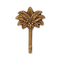 4" Antiqued Gold Cast Iron Palm Tree Wall Hook. Coat hanger isolated on a plain white background, in a gold metal finish.