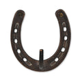 4" Antiqued Bronze Cast Iron Horseshoe Wall Hook. Coat hanger isolated on a plain white background, showing a metal surface.