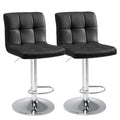Set of Two Black And Silver Faux Leather And Aluminum Adjustable Height Swivel Bar Chairs on a white background