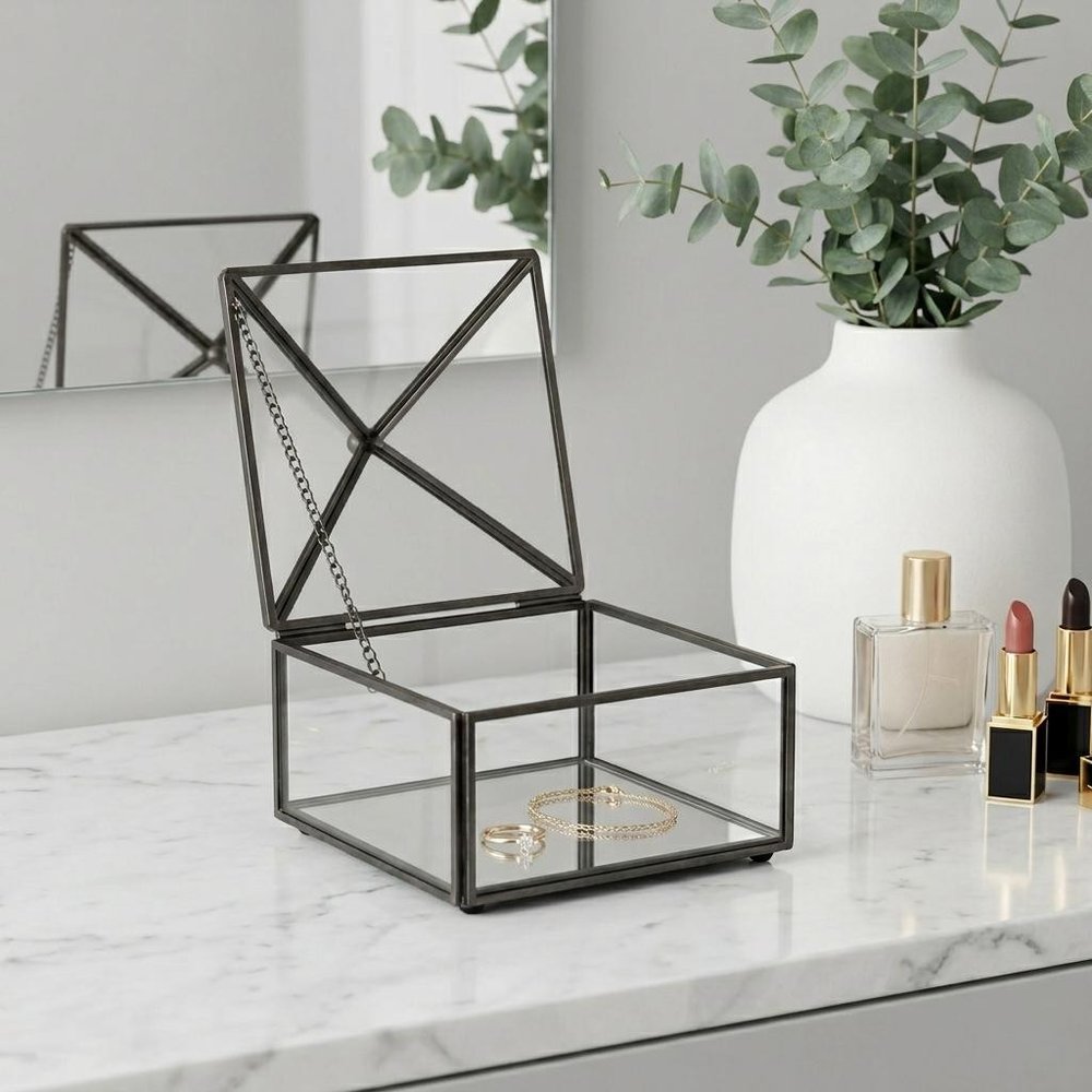 4" Black Glass Mirrored Accessory Box With Metal Accents. Jewelry boxe isolated on a plain white background, showing a glass surface.