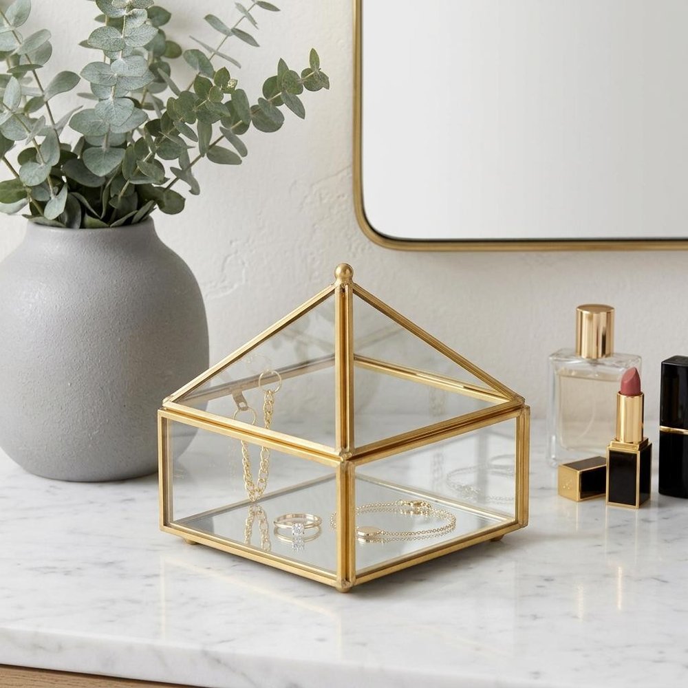 4" Gold Glass Mirrored Accessory Box With Metal Accents. Jewelry boxe isolated on a plain white background, showing a glass surface.