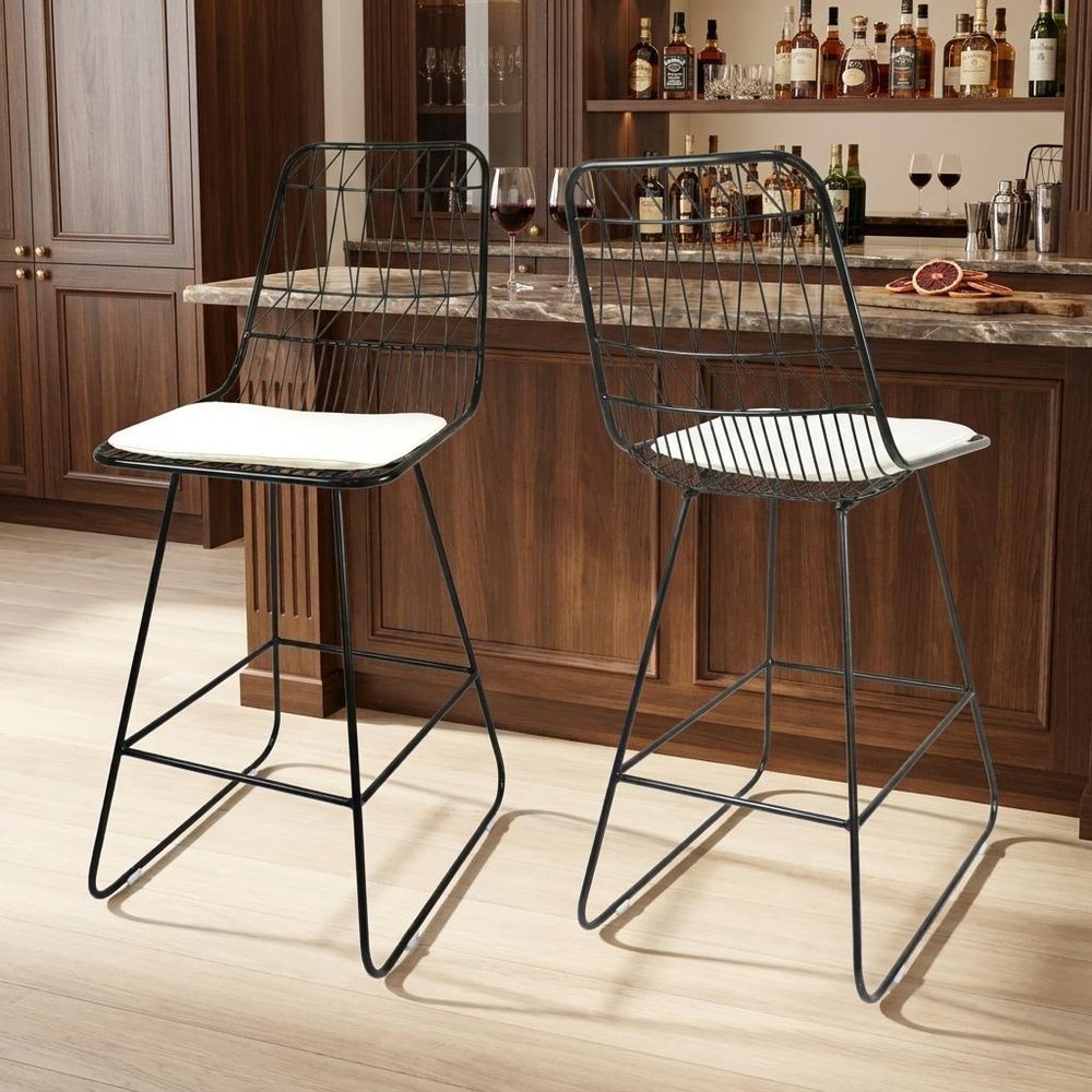 Set of Two 30" Black Iron Outdoor Bar Height Chairs in a home interior