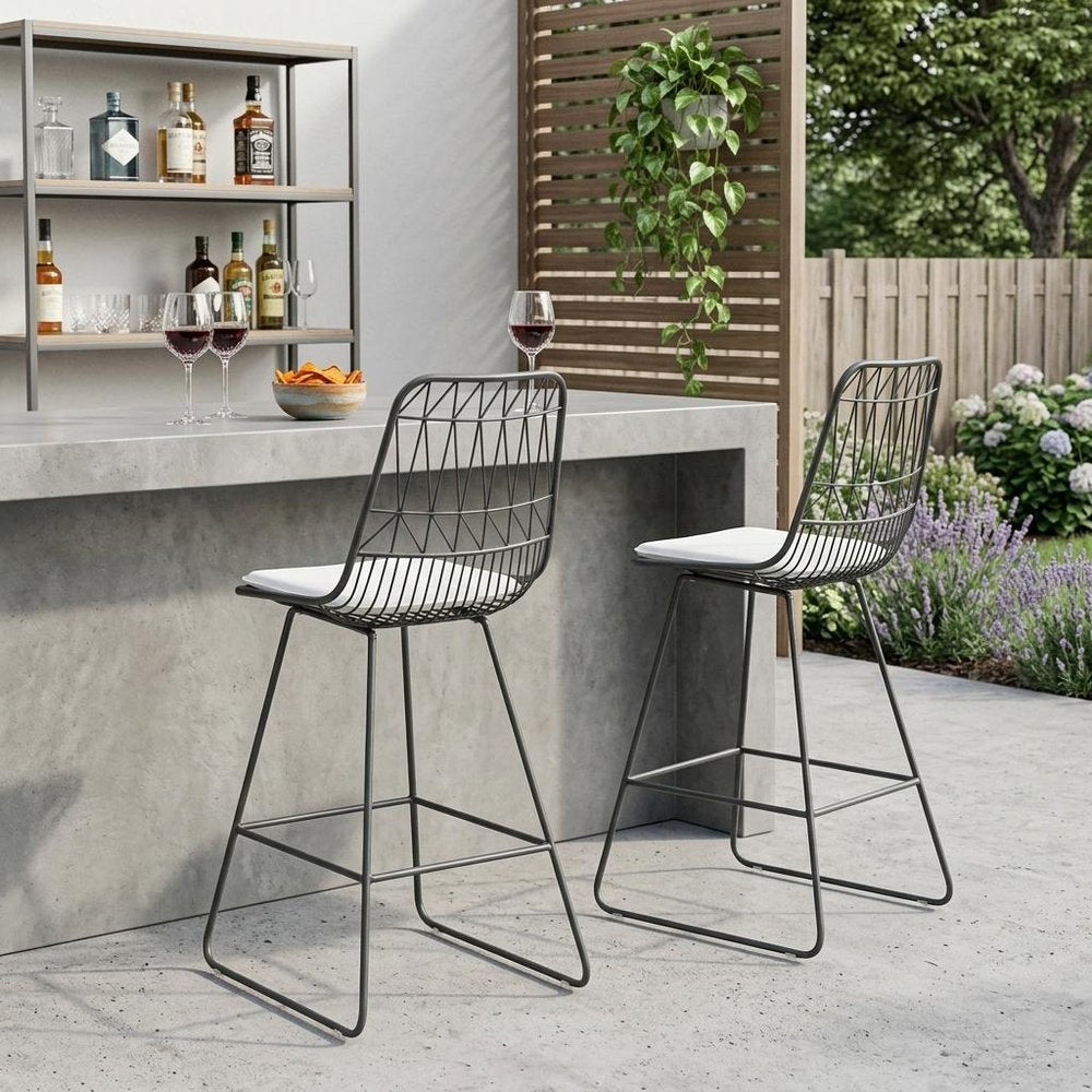 Set of Two 30" Gray And Ivory Iron And Cushion Outdoor Bar Height Chairs in a home interior