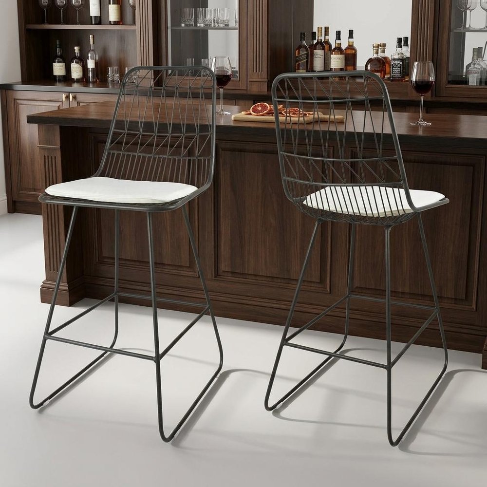 Set of Two 30" Gray And Ivory Iron And Cushion Outdoor Bar Height Chairs in a home interior