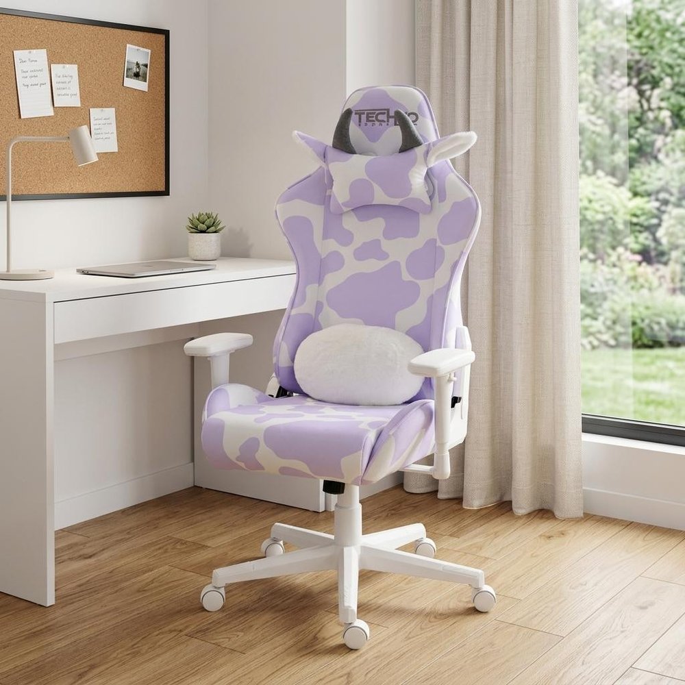 Lavender and White Cow Print Adjustable Height Rolling Gaming Chair in a home interior