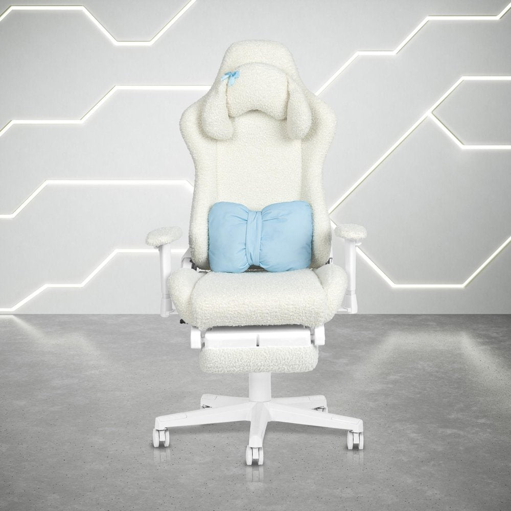 White fluffy gaming chair with a blue bow pillow and footrest on a concrete floor with a geometric light background.