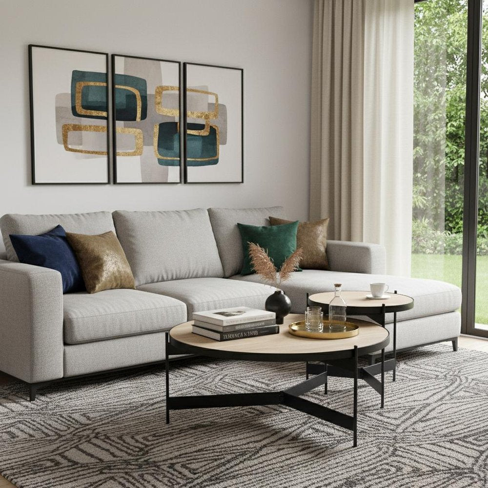 Set Of Two Beige and Black Stone and Iron Round Nested Coffee Tables in a home interior