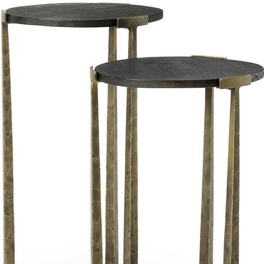 Set of Two Black and Antiqued Gold Distressed Solid Wood and Iron Round Cross Legs Nested Tables on a white background