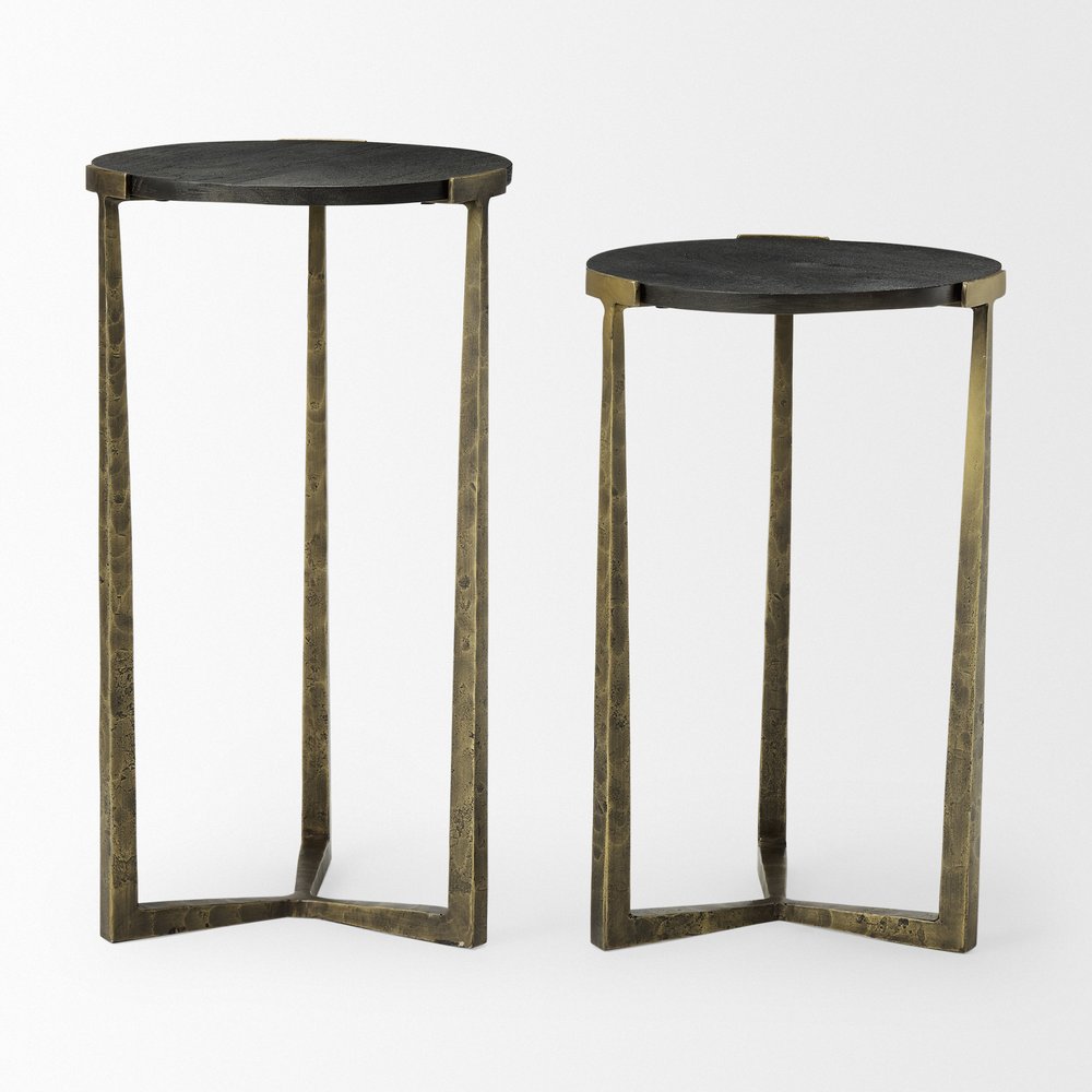 Set of Two Black and Antiqued Gold Distressed Solid Wood and Iron Round Cross Legs Nested Tables on a white background