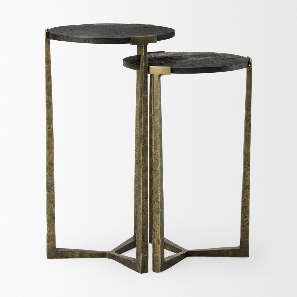Set of Two Black and Antiqued Gold Distressed Solid Wood and Iron Round Cross Legs Nested Tables on a white background