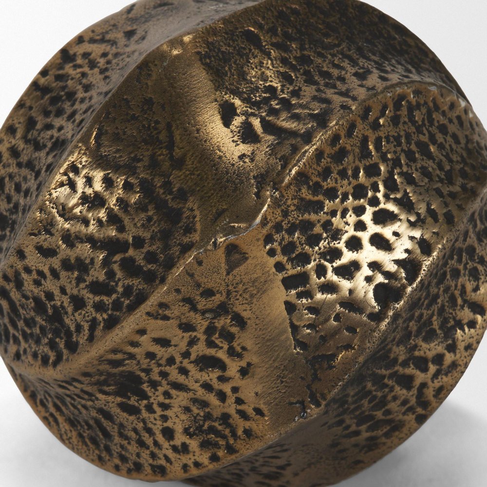 Detail view of 4" Antiqued Gold Metal Sphere Tabletop Sculpture, filling the frame with the metal texture.