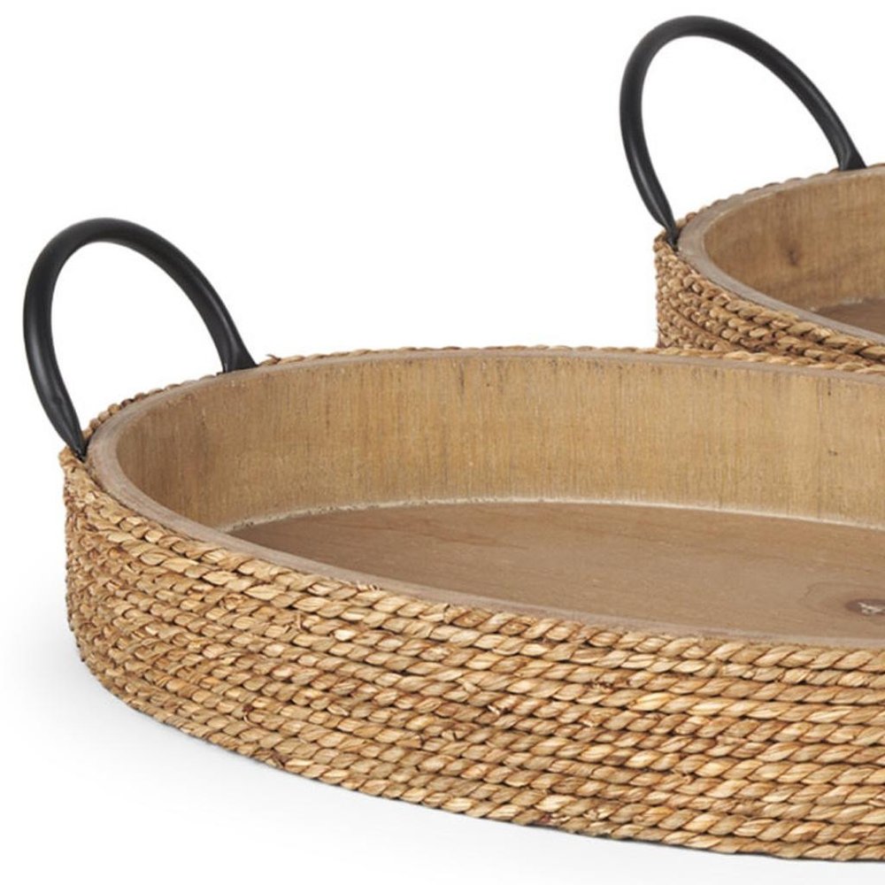 Set of Two Natural and Black Jute Metal And Solid Wood Oval Serving Trays With Handles on a white background