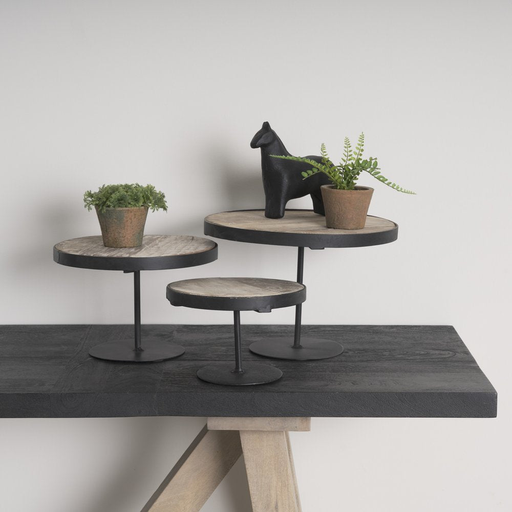 Set of Three Black And Light Brown Iron And Solid Wood Round Risers on a white background