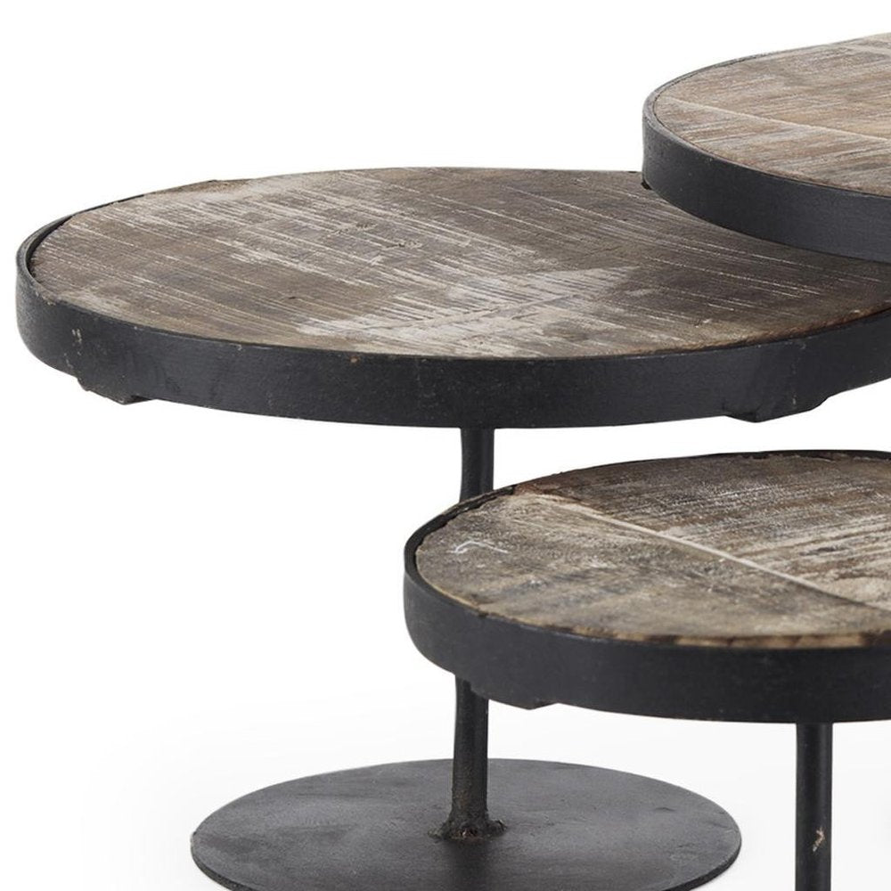 Set of Three Black And Light Brown Iron And Solid Wood Round Risers on a white background
