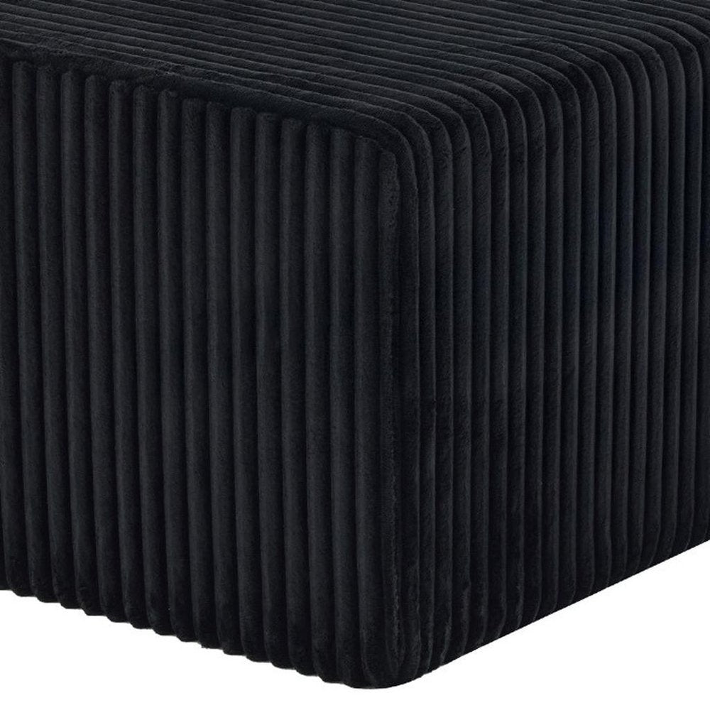 Cropped view of 51" Black Corduroy Ottoman focusing on the black surface.