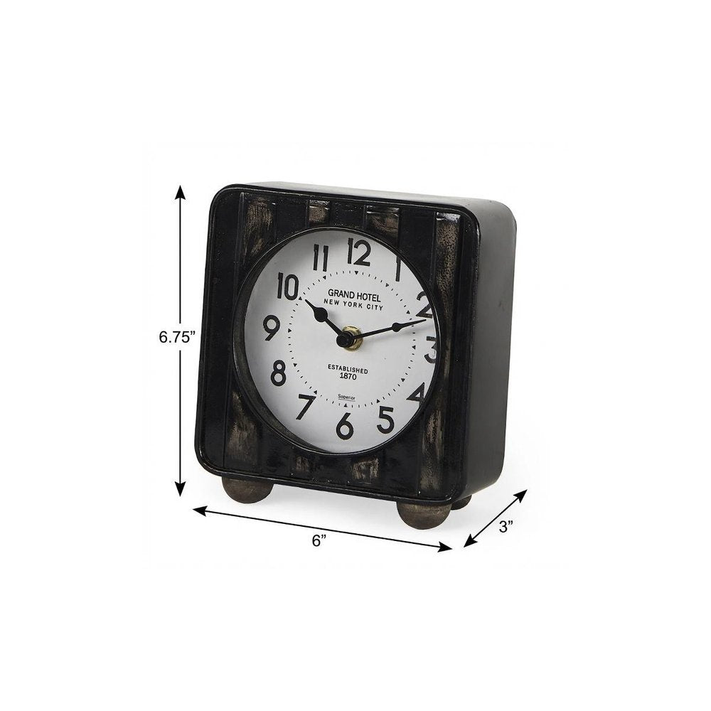 6" Black Metal Analog Round Wall Clock. Wall clock isolated on a plain white background, showing a black metal surface.