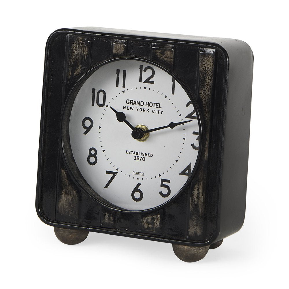 6" Black Metal Analog Round Wall Clock. Wall clock isolated on a plain white background, in a black metal finish.