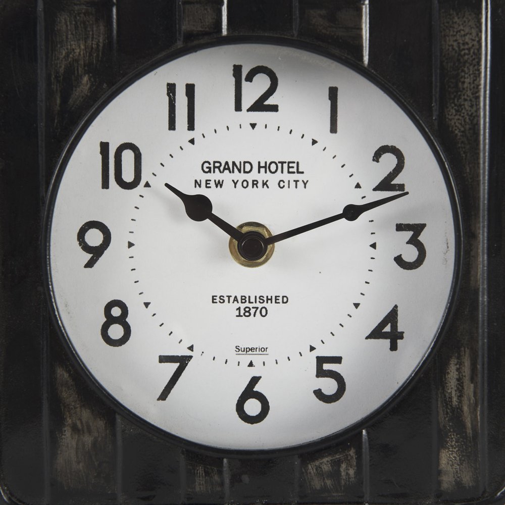 6" Black Metal Analog Round Wall Clock photographed against a dark studio background in black.