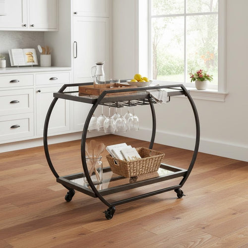 Black and gunmetal metal rolling kitchen cart with glass shelves and wine glass rack in a kitchen.
