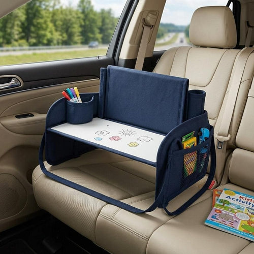 Blue heavy duty plastic H-shape writing desk with storage pockets and a drawing surface, on a car seat.
