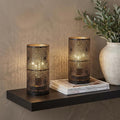 8" Black Metal Pierced Geometric Desk Lamp With Cylinder Shade in a home interior