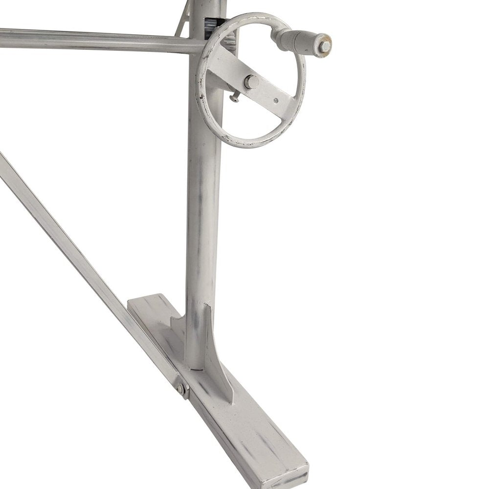 Adjustable Antiqued White Solid Wood and Iron Trestle Standing Desk on a white background