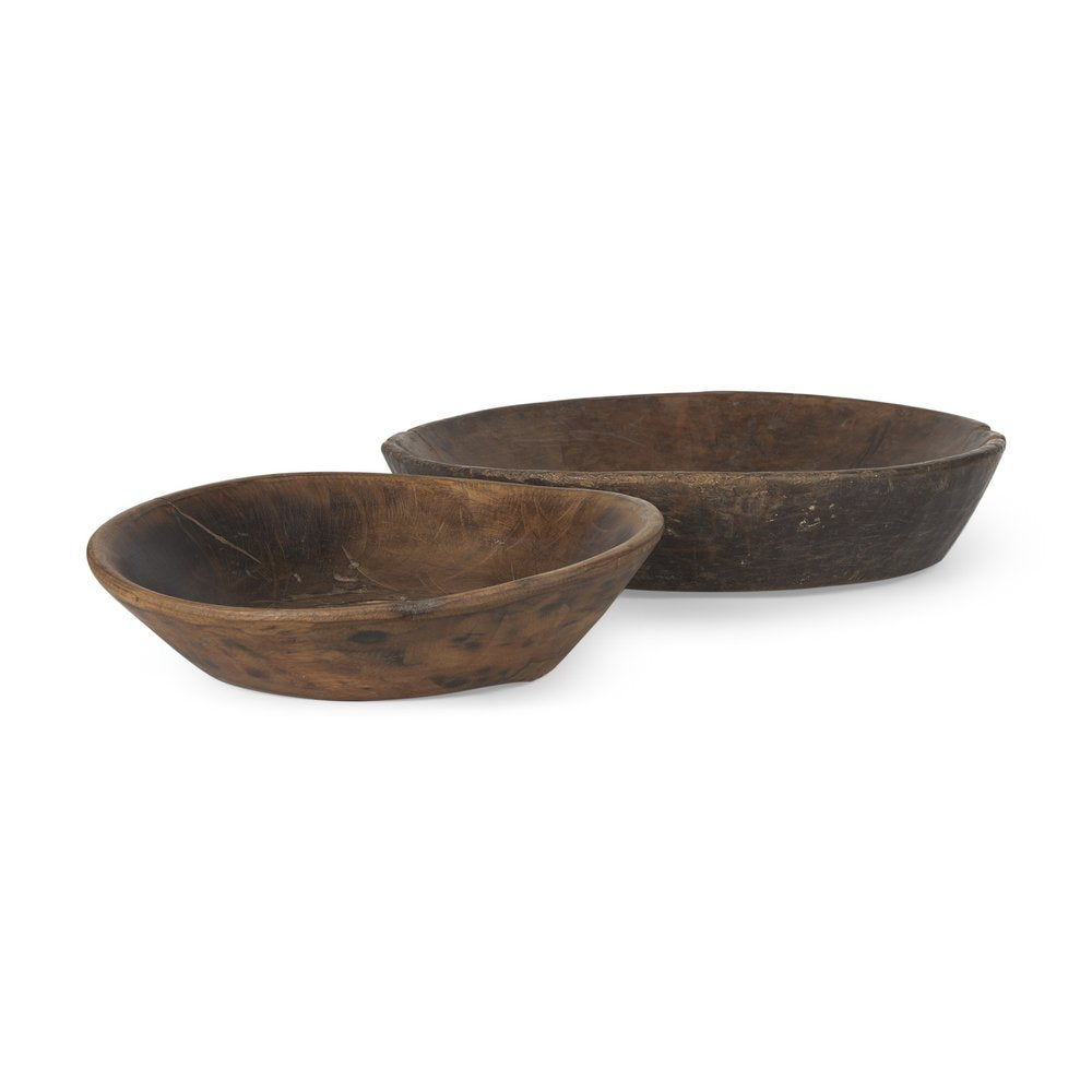 Two rustic brown solid wood bowls on a white background.