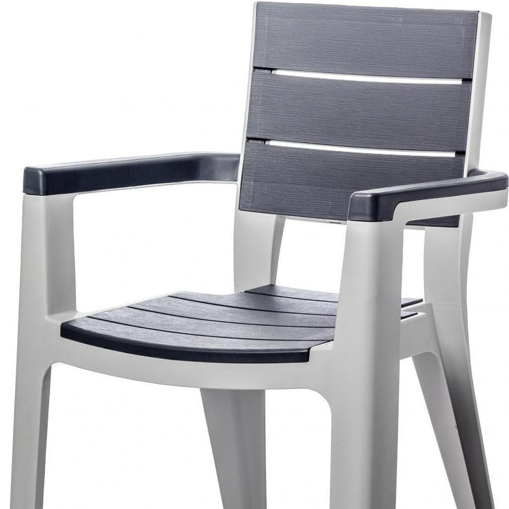 Nine Piece Gray Plastic Outdoor Patio Set With Table