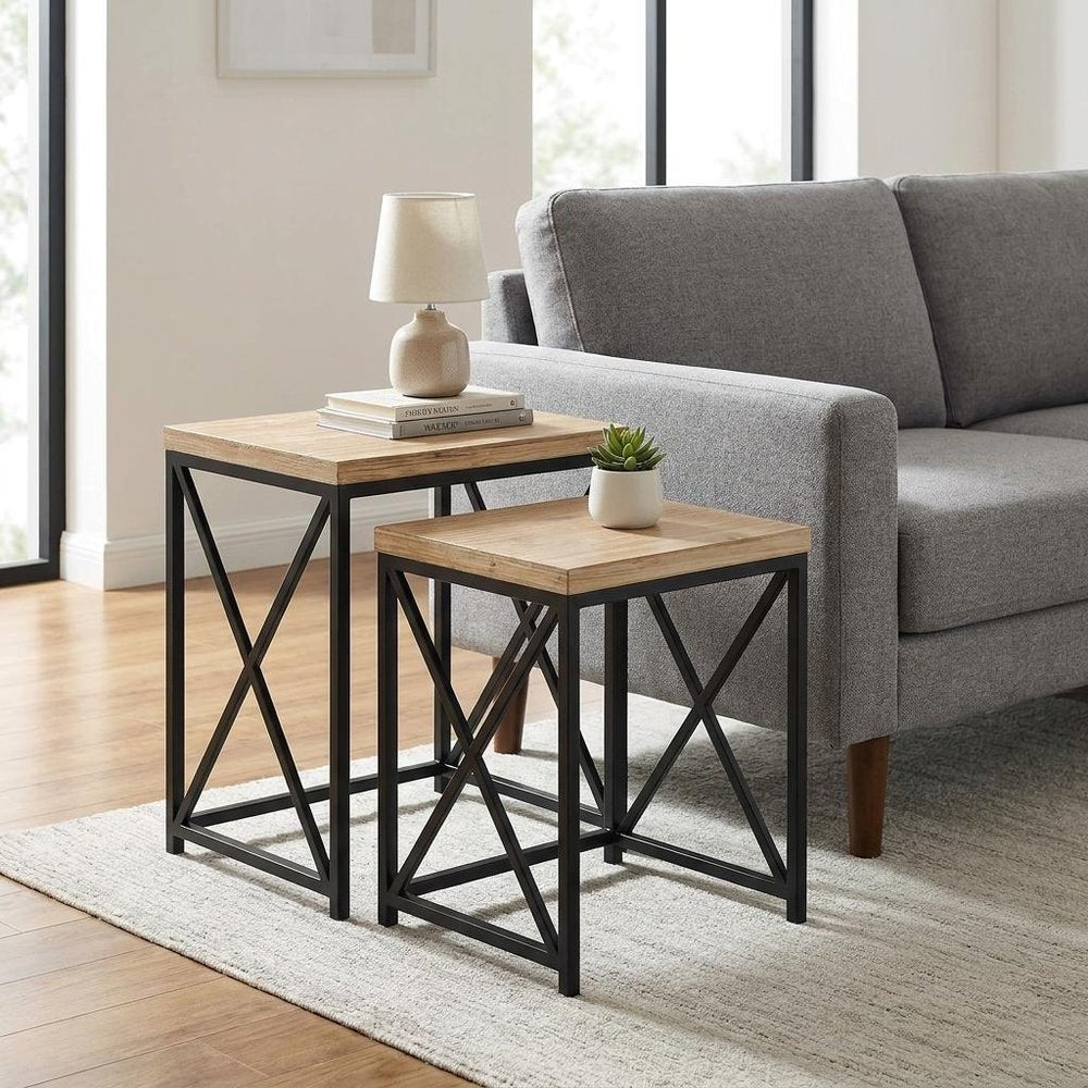 Set of Two Light Brown and Black Distressed Solid Wood and Steel Nested Tables on a white background