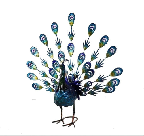 A metallic peacock sculpture with blue and purple iridescent feathers stands on a white background.