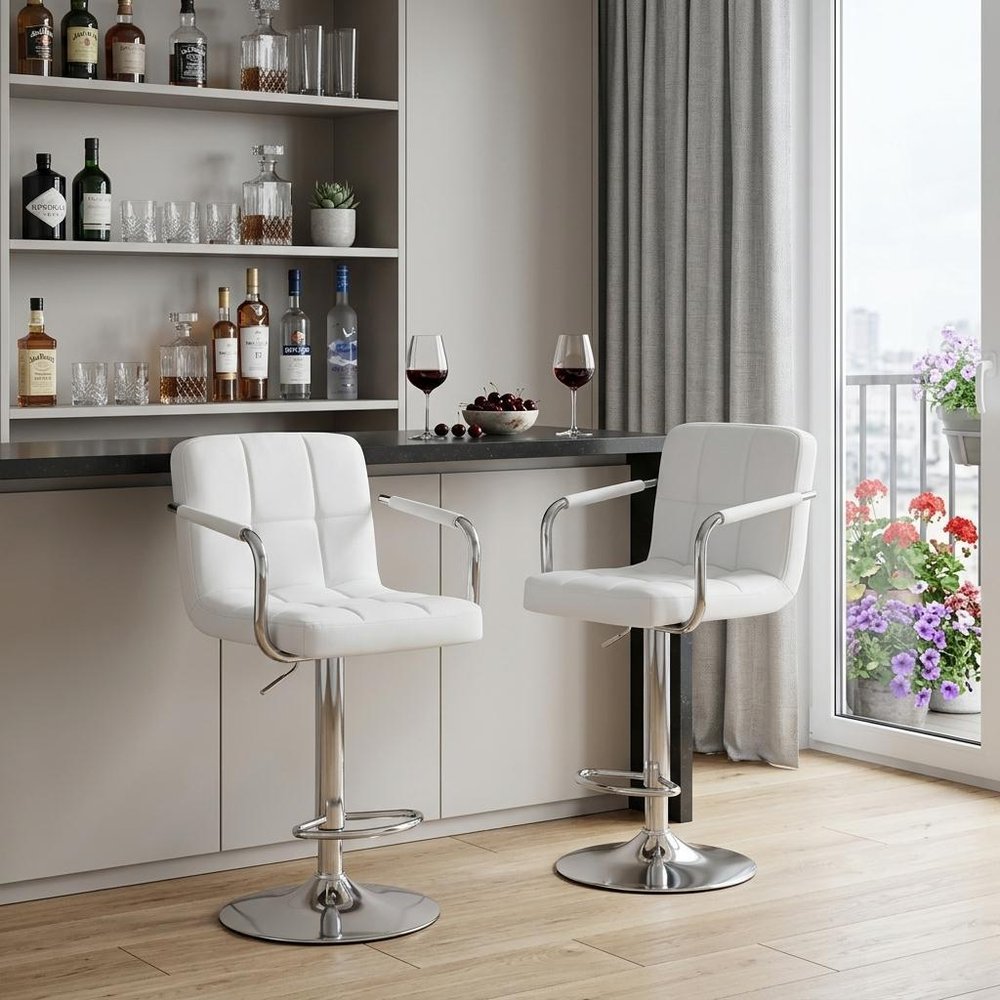 Set of Two Black And Silver Faux Leather And Aluminum Adjustable Height Swivel Bar Chairs in a home interior