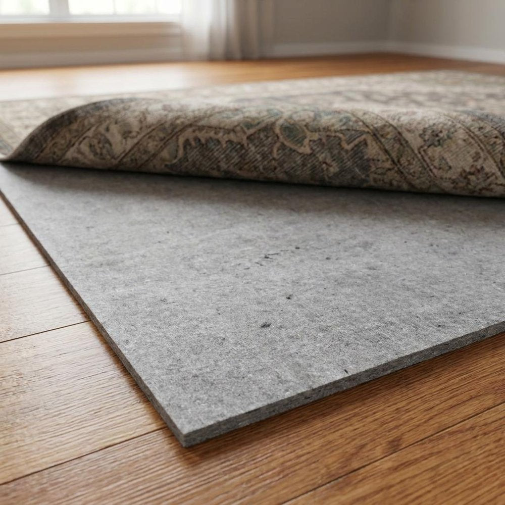 6' x 9' Gray And Black Non Slip Rug Pad shown as a full-frame view of the light gray and dark brown surface.