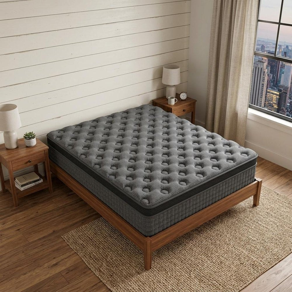 14" Twin Lumbar Support Memory Foam Hybrid Mattress styled in a furnished interior with a cream wall on a dark wood floor.