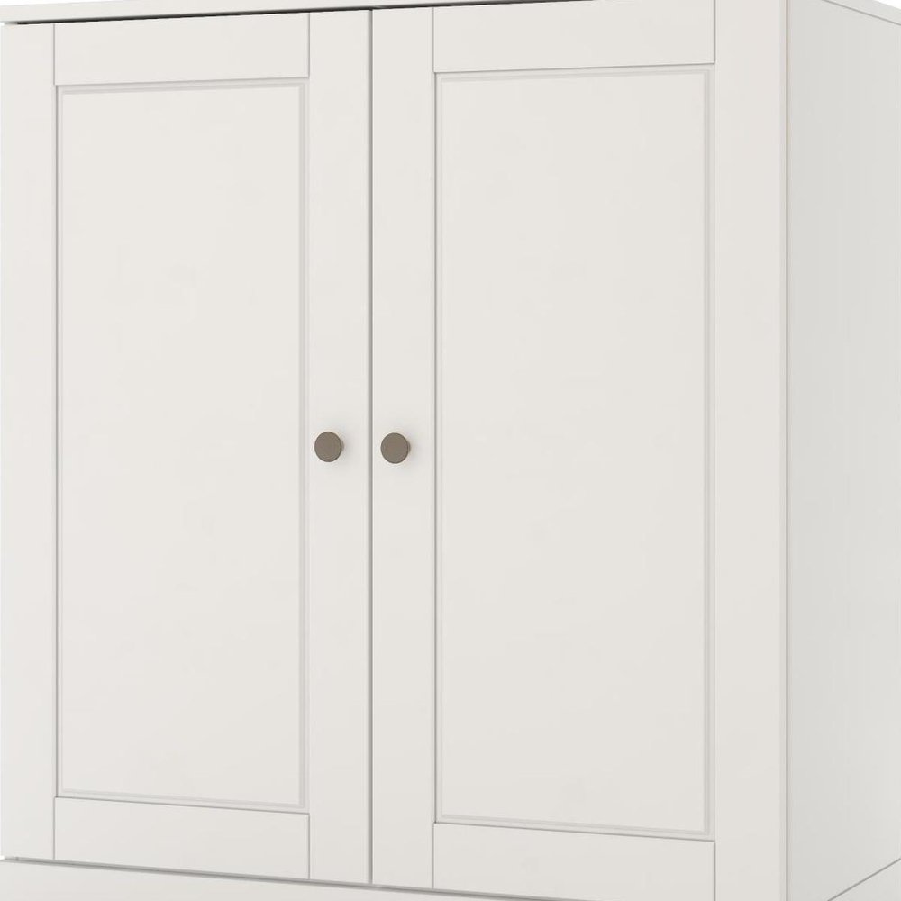 32" White Solid Wood Raised Panel Double Door Linen Cabinet. Bathroom storage isolated on a plain white background, showing a white wood surface.