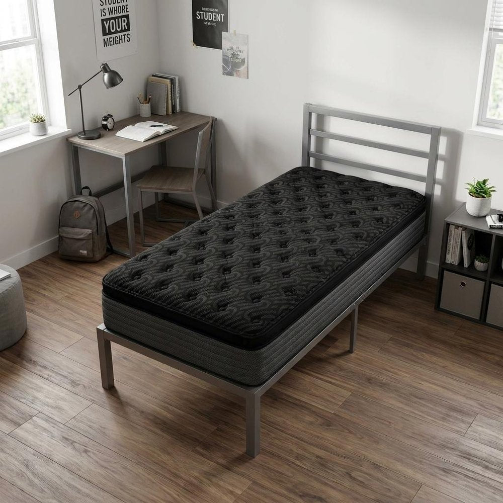 15" Copper Infused Twin Gel Memory Foam Ultra plush Hybrid Mattress styled in a furnished interior with an off-white wall on a wood floor in black.