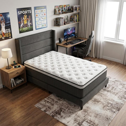 Twin memory foam hybrid mattress with a white and gray euro top on a gray bed frame in a bedroom.