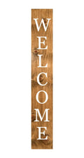 Vertical wooden porch sign with "WELCOME" in white letters against a natural wood background.
