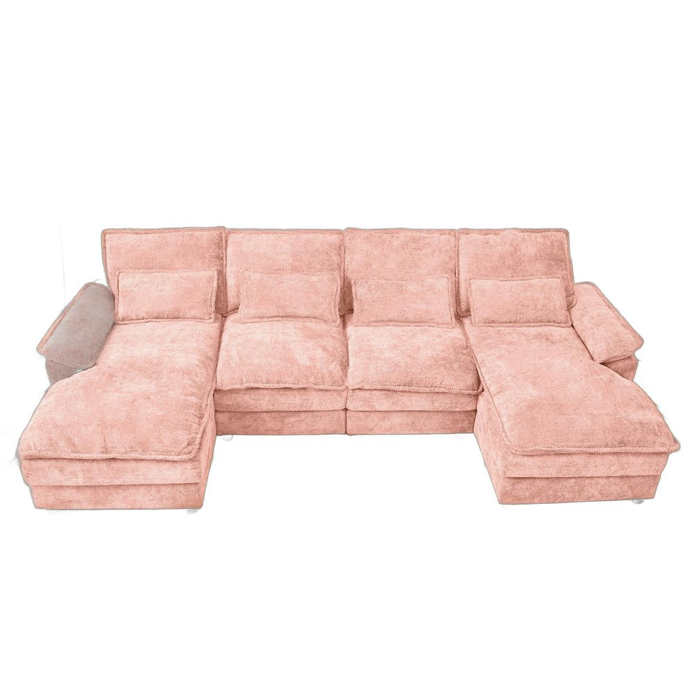 Pink chenille U-shaped four-piece modular sofa with chaise sections and toss pillows on a white background.