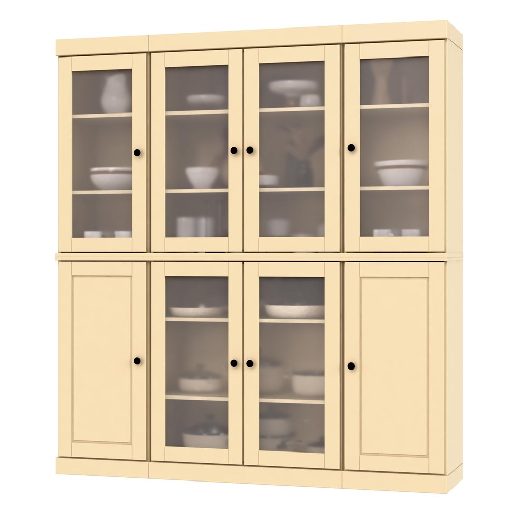 A cream-colored solid wood pantry or storage closet with glass doors on top and solid doors on the bottom.