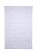 White Turkish cotton bath rug with tone-on-tone polka dot pattern and border.