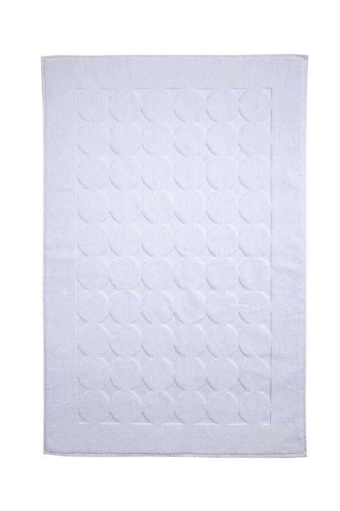 White Turkish cotton bath rug with tone-on-tone polka dot pattern and border.