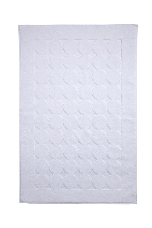 White Turkish cotton bath rug with tone-on-tone polka dot pattern and border.