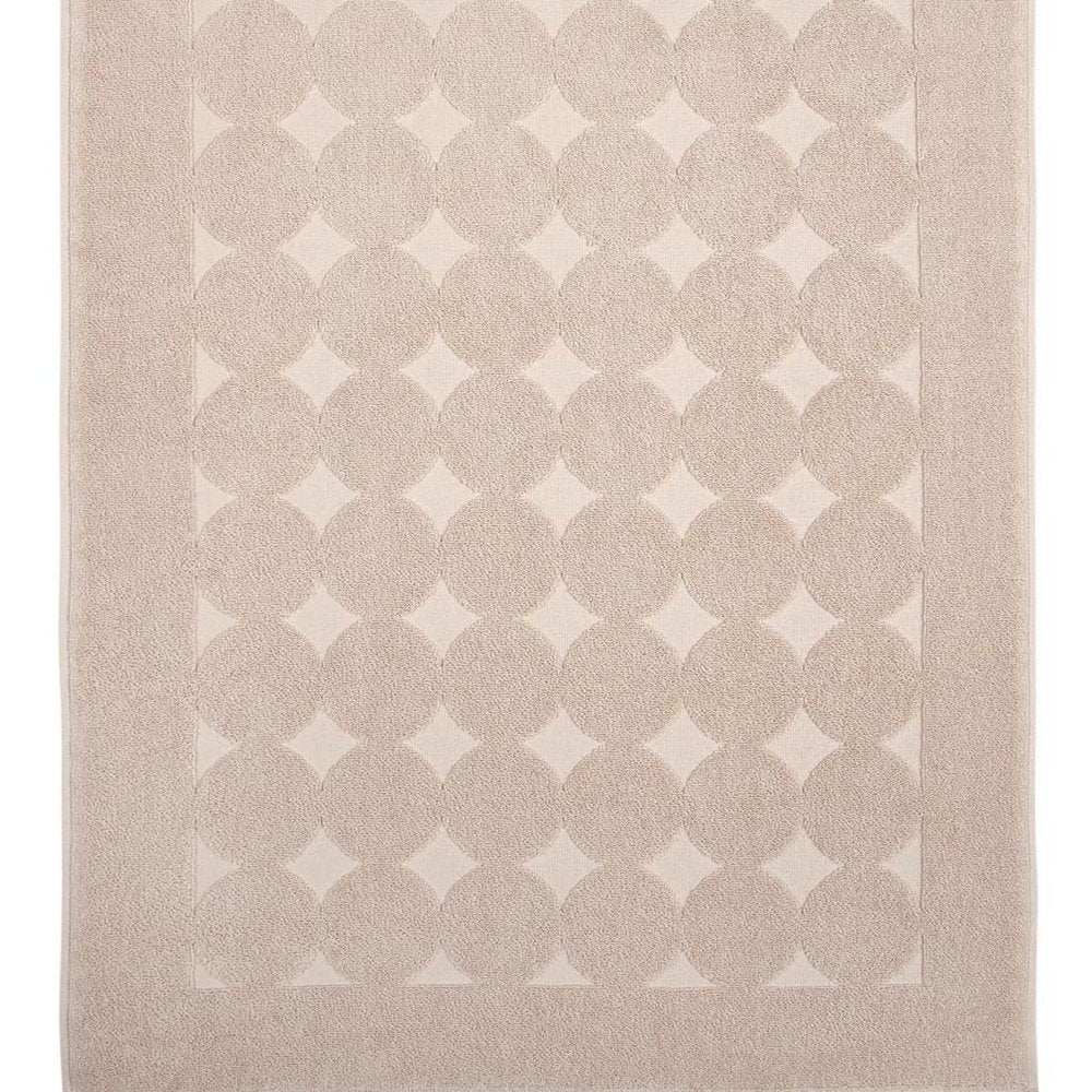 Cropped view of 24" X 35" White Tone on Tone Polka Dot Turkish Cotton Bath Rug focusing on the white cotton surface.